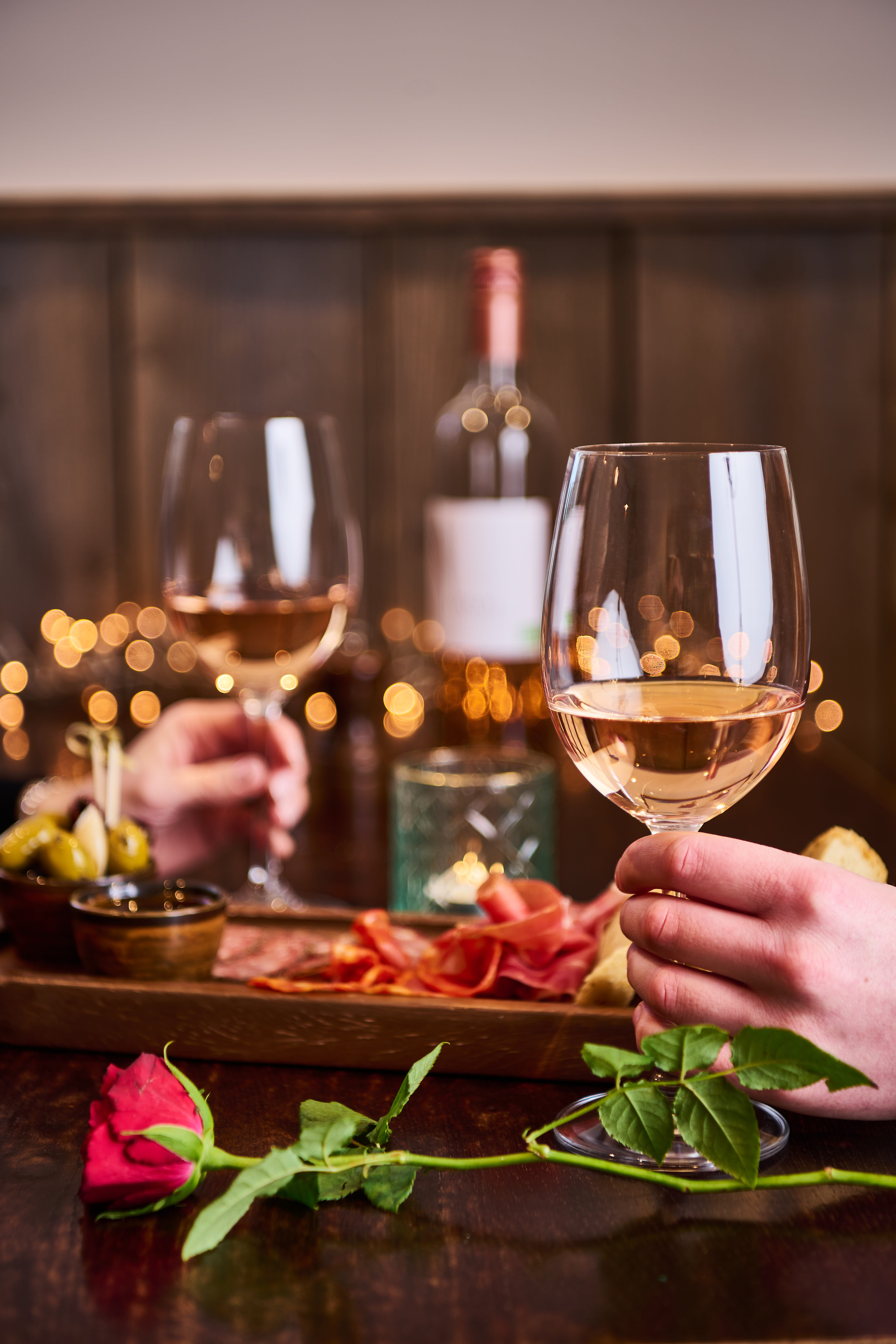 Two people drinking wine at The Maple in North Somerset