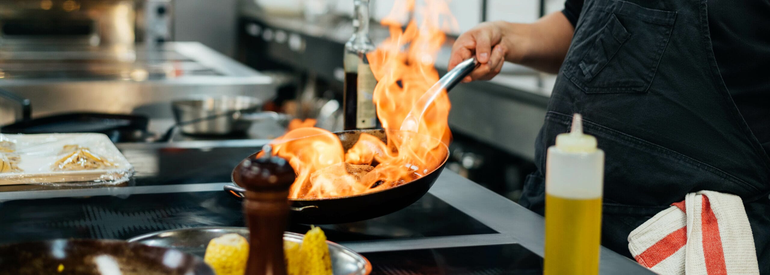 side-view-male-chef-flambeing-dish-2-scaled.jpg?w=1024&h=367&scale